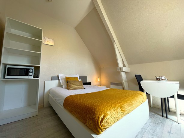 Imagen de la habitación del Hotel les Quatre Saisons. Foto 5
