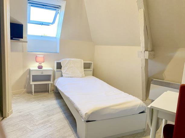 Imagen de la habitación del Hotel les Quatre Saisons. Foto 9