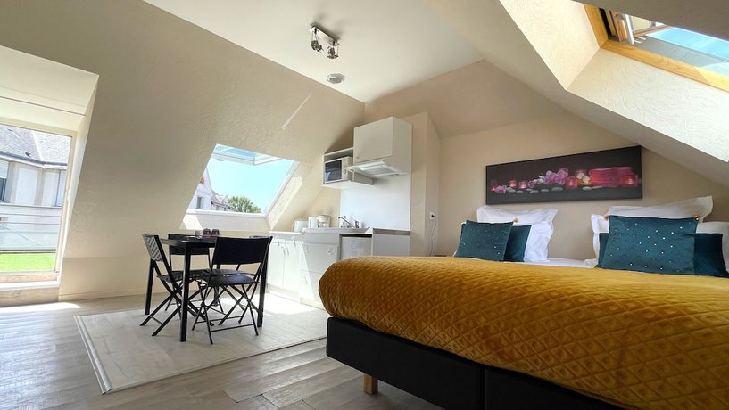 Imagen de la habitación del Hotel les Quatre Saisons. Foto 16