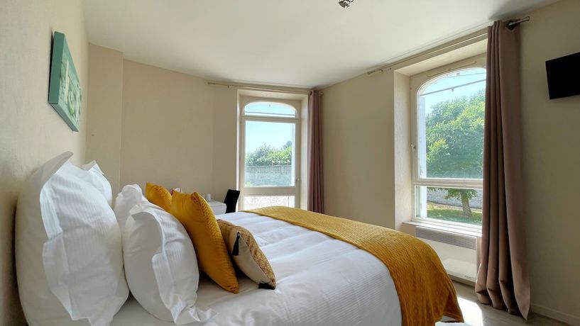 Imagen de la habitación del Hotel les Quatre Saisons. Foto 18
