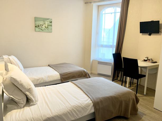 Imagen de la habitación del Hotel les Quatre Saisons. Foto 19