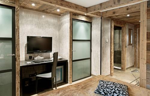 Imagen de la habitación del Hotel les suites - maison bouvier. Foto 6