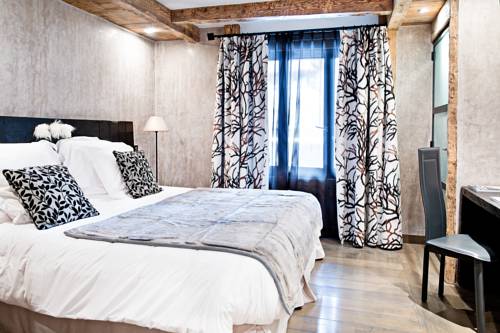 Imagen de la habitación del Hotel les suites - maison bouvier. Foto 9