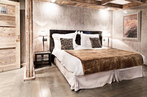 Imagen de la habitación del Hotel les suites - maison bouvier. Foto 11