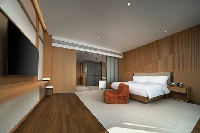 Imagen de la habitación del Hotel leshanchanyiyilejiudian. Foto 1
