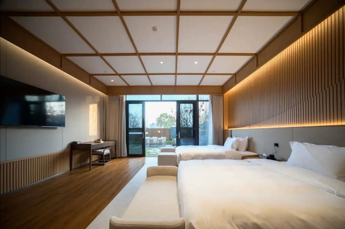 Imagen de la habitación del Hotel leshanchanyiyilejiudian. Foto 3