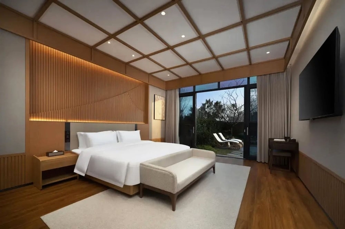 Imagen de la habitación del Hotel leshanchanyiyilejiudian. Foto 4