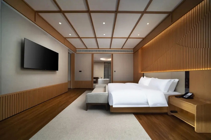 Imagen de la habitación del Hotel leshanchanyiyilejiudian. Foto 6