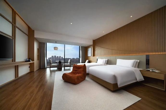 Imagen de la habitación del Hotel leshanchanyiyilejiudian. Foto 7