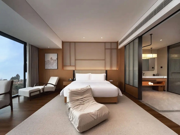 Imagen de la habitación del Hotel leshanchanyiyilejiudian. Foto 9