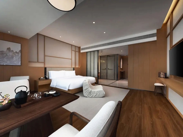 Imagen de la habitación del Hotel leshanchanyiyilejiudian. Foto 10