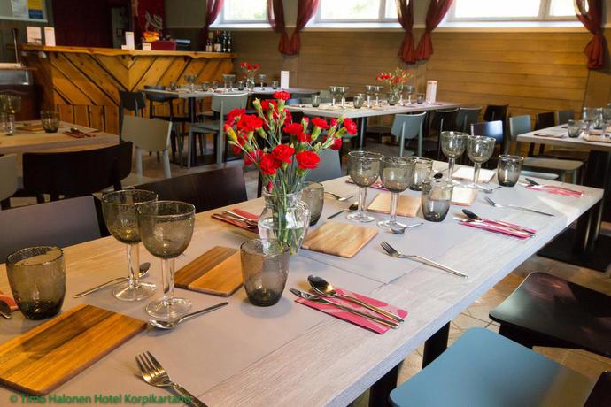 Imagen del bar/restaurante del Hotel li Korpikartano. Foto 2