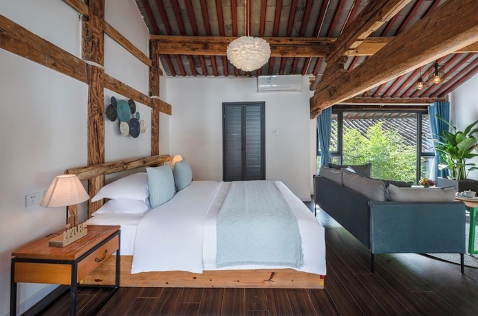 Imagen de la habitación del Hotel lijiangluxianbaomimihuayuankezhan. Foto 2