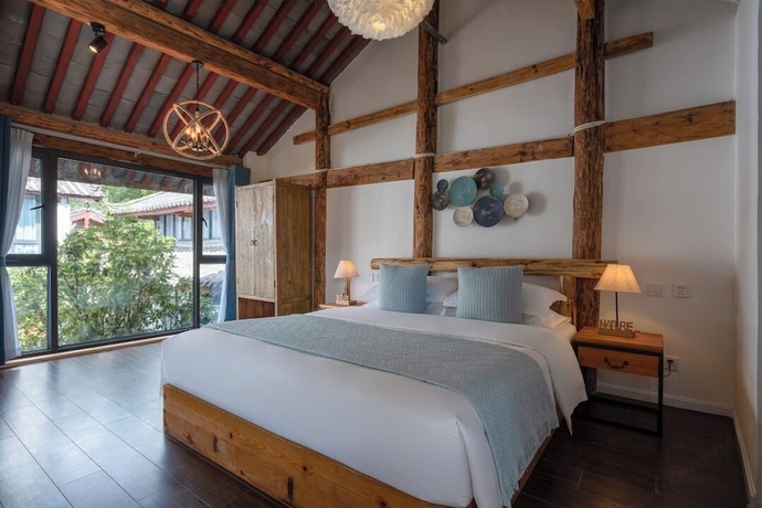 Imagen de la habitación del Hotel lijiangluxianbaomimihuayuankezhan. Foto 3