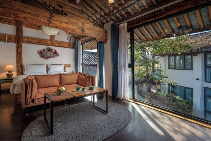 Imagen de la habitación del Hotel lijiangluxianbaomimihuayuankezhan. Foto 4