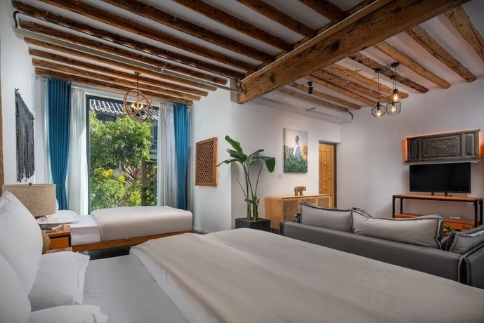 Imagen de la habitación del Hotel lijiangluxianbaomimihuayuankezhan. Foto 6