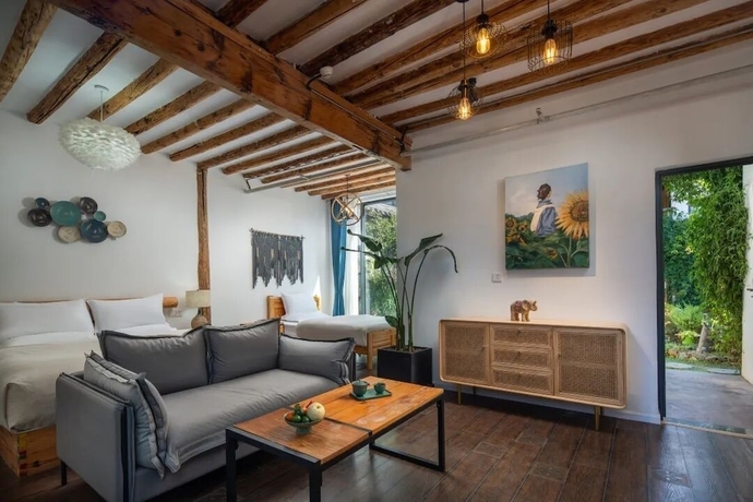 Imagen de la habitación del Hotel lijiangluxianbaomimihuayuankezhan. Foto 7