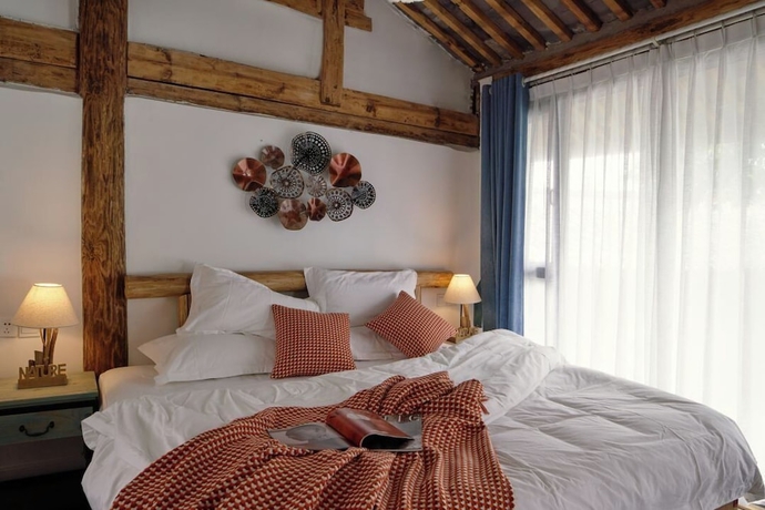Imagen de la habitación del Hotel lijiangluxianbaomimihuayuankezhan. Foto 10