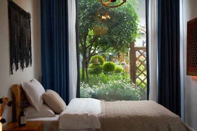 Imagen de la habitación del Hotel lijiangluxianbaomimihuayuankezhan. Foto 12