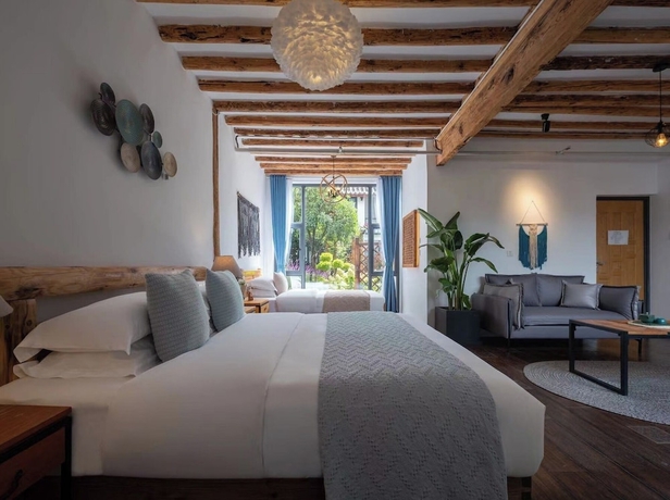 Imagen de la habitación del Hotel lijiangluxianbaomimihuayuankezhan. Foto 14