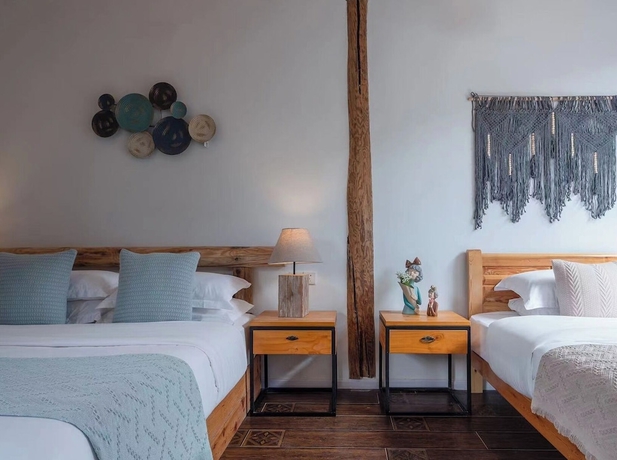 Imagen de la habitación del Hotel lijiangluxianbaomimihuayuankezhan. Foto 15