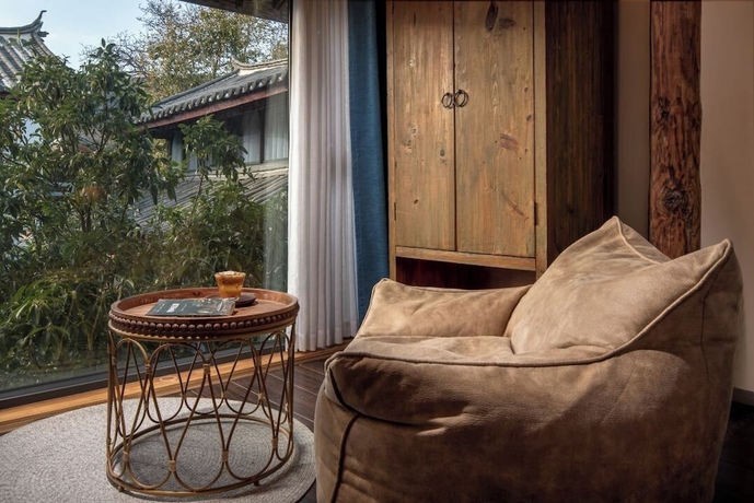 Imagen de la habitación del Hotel lijiangluxianbaomimihuayuankezhan. Foto 16