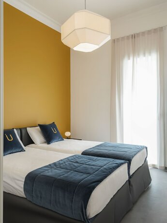 Imagen de la habitación del Hotel living u HomeSuites. Foto 19