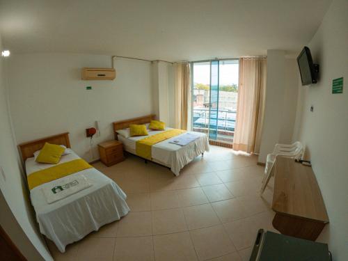 Imagen de la habitación del Hotel los leones Melgar. Foto 17