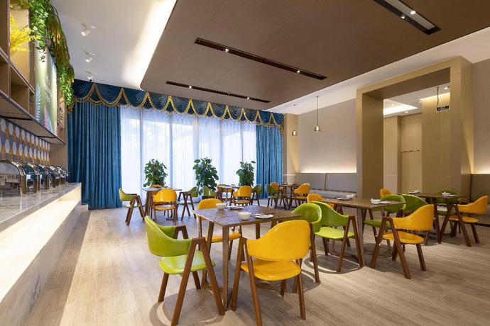 Imagen del bar/restaurante del Hotel mango crystal hotel. Foto 6