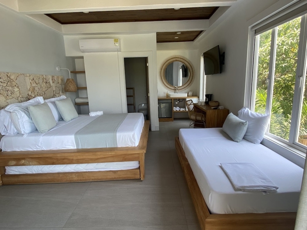 Imagen de la habitación del Hotel oasis tolu boutique. Foto 4