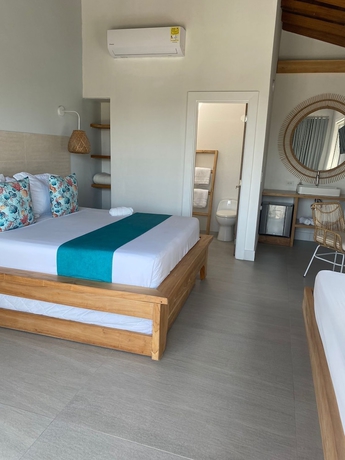 Imagen de la habitación del Hotel oasis tolu boutique. Foto 7