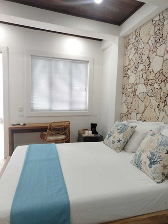 Imagen de la habitación del Hotel oasis tolu boutique. Foto 13