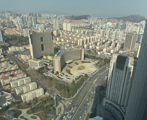 Imagen de la habitación del Hotel qingdaowanxianghaijing. Foto 13