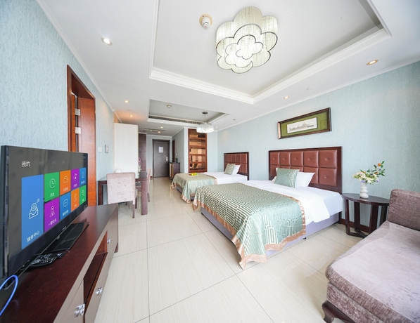 Imagen de la habitación del Hotel qingdaowanxianghaijing. Foto 14
