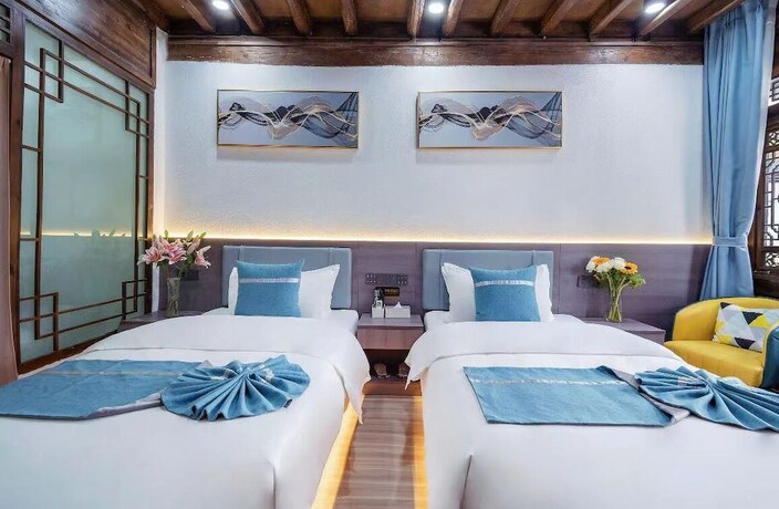 Imagen de la habitación del Hotel qingxuege. Foto 8