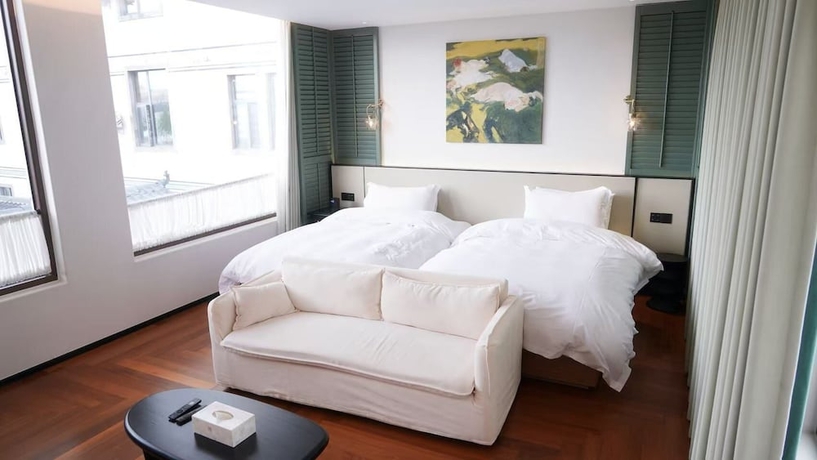 Imagen de la habitación del Hotel shanhaixijing.Garden Holiday Homestay. Foto 8