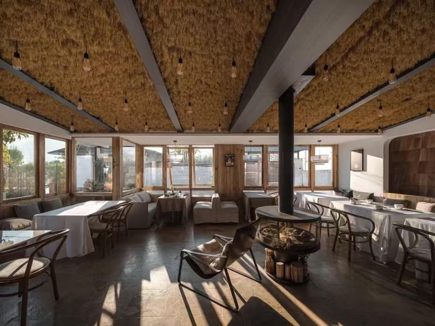 Imagen del bar/restaurante del Hotel shanhaixijing.Garden Holiday Homestay. Foto 6