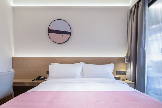 Imagen de la habitación del Hotel shenzhenshijinyuehuayuanjiudian. Foto 6