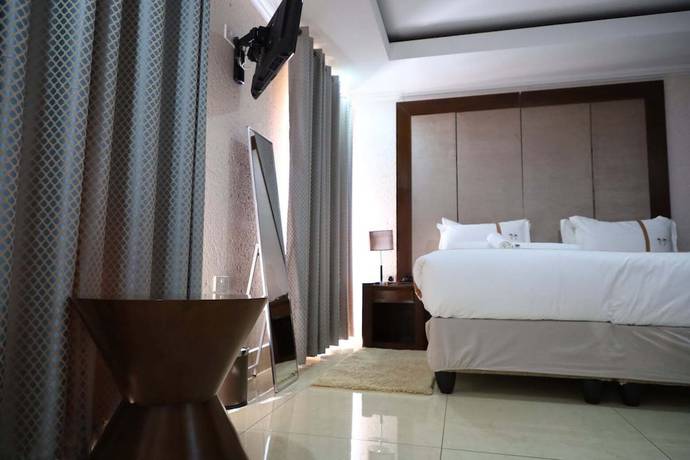 Imagen de la habitación del Hotel the distinction boutique hotel. Foto 14