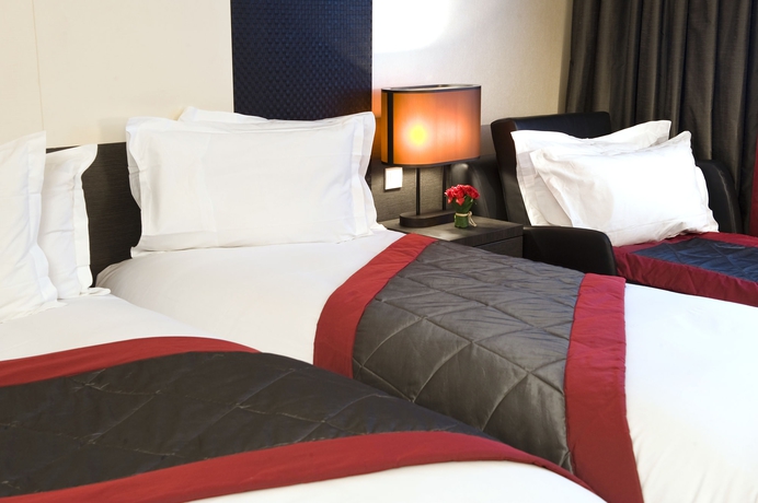 Imagen de la habitación del Hotel voco Paris Montparnasse. Foto 11