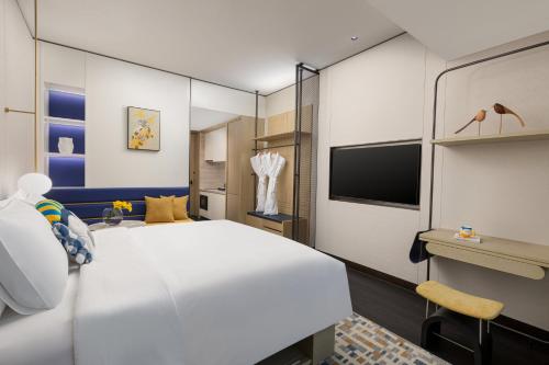 Imagen de la habitación del Hotel voco Suites Shanghai Hongqiao CBD, an IHG. Foto 14