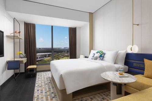 Imagen de la habitación del Hotel voco Suites Shanghai Hongqiao CBD, an IHG. Foto 16