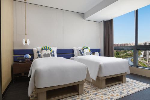 Imagen de la habitación del Hotel voco Suites Shanghai Hongqiao CBD, an IHG. Foto 18