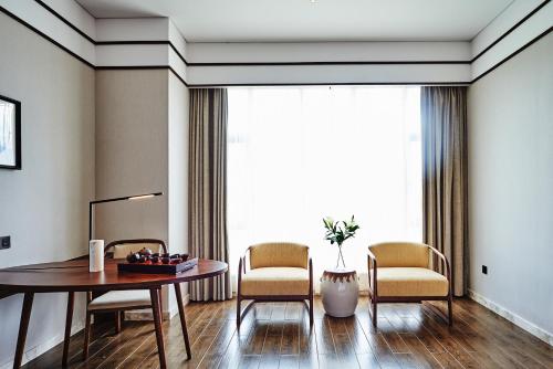 Imagen de la habitación del Hotel wo ge yi shu &bull;hong cun shui mo li hotel. Foto 5