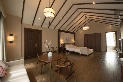 Imagen de la habitación del Hotel wo ge yi shu &bull;hong cun shui mo li hotel. Foto 7