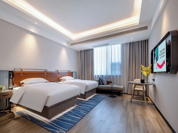 Imagen de la habitación del Hotel yishangjiudianhechibamadian. Foto 5