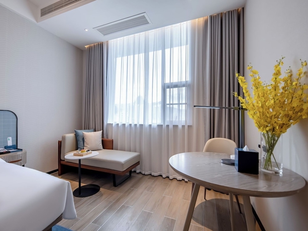 Imagen de la habitación del Hotel yishangjiudianhechibamadian. Foto 7