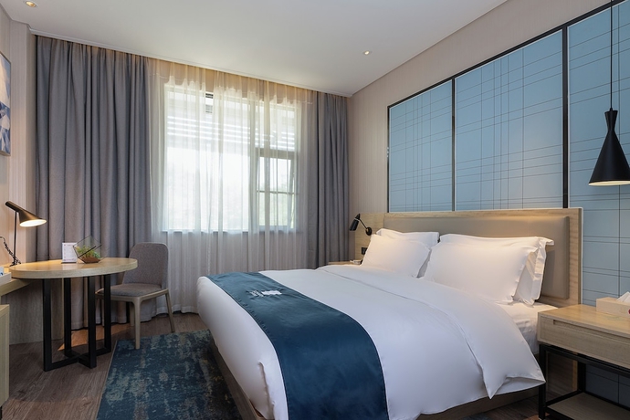 Imagen de la habitación del Hotel yishangjiudiannanningqingxiushandian. Foto 3