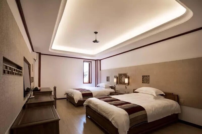 Imagen de la habitación del Hotel zhouningfenggushanju. Foto 8