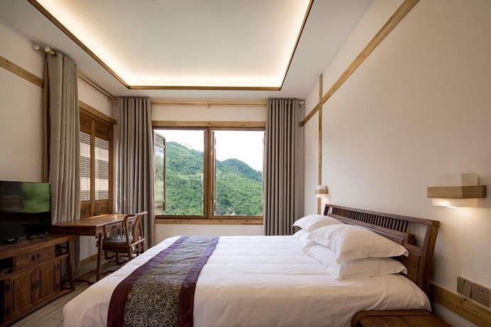 Imagen de la habitación del Hotel zhouningfenggushanju. Foto 10